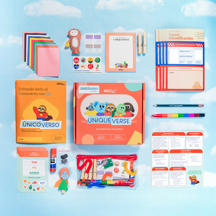 A social emotional learning educational activity kit for children 'The Uniqueverse Kit' by MILLU, displayed as a flat lay on a light blue sky-patterned background. The kit contains various craft supplies.