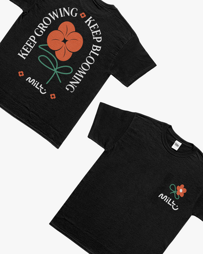 Front and back of the black MILLU Bloom T-shirt, with a small chest flower and large Keep Growing Keep Blooming back design.